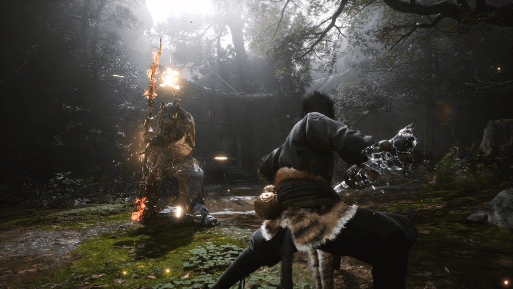 Black Myth Wukong: a mighty warrior stands firm against a tall enemy holding a fiery staff.