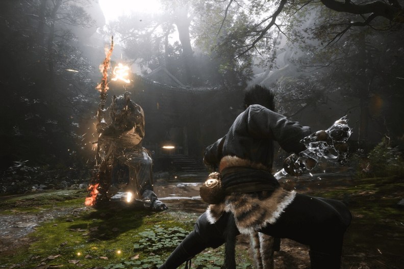 Black Myth Wukong: a mighty warrior stands firm against a tall enemy holding a fiery staff.